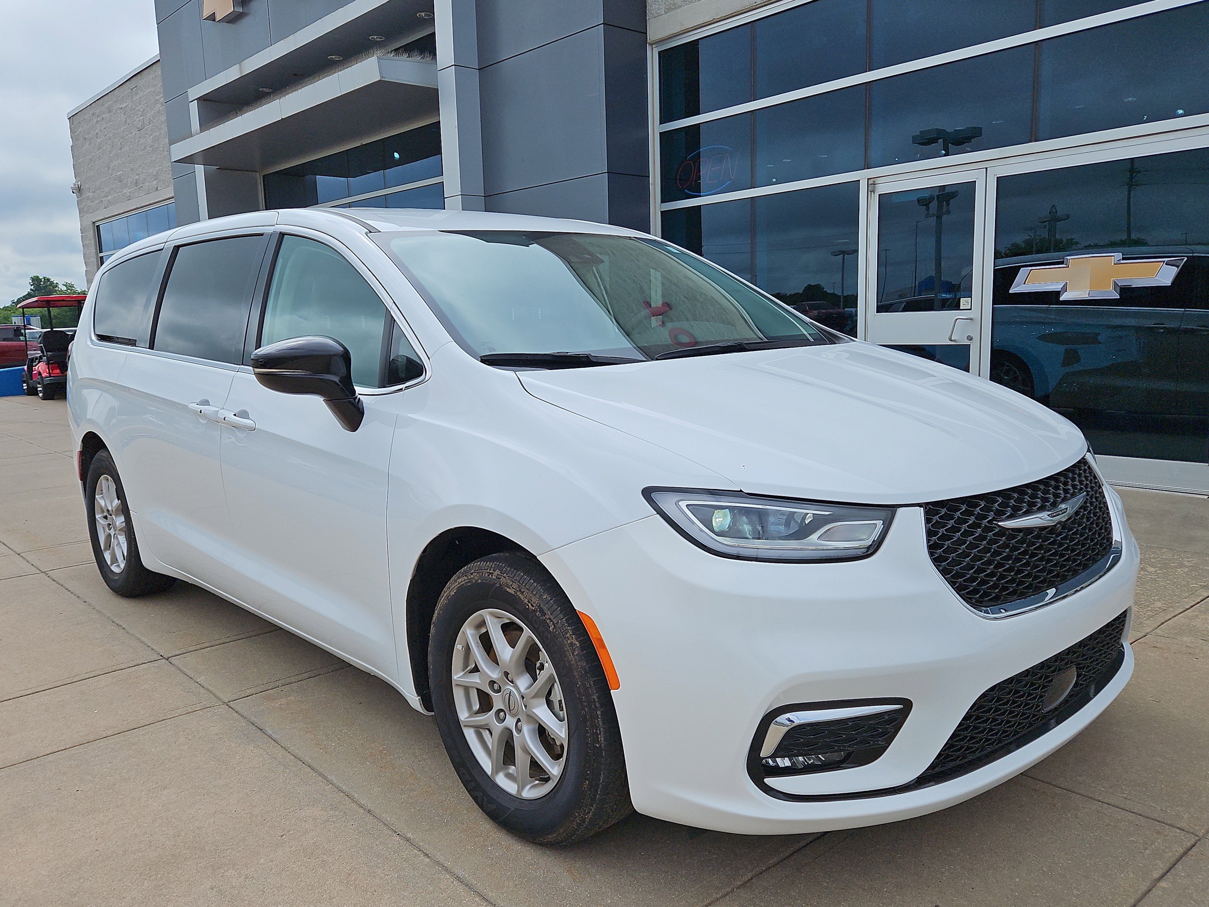 2024 Chrysler Pacifica Touring L in White — front three-quarter view