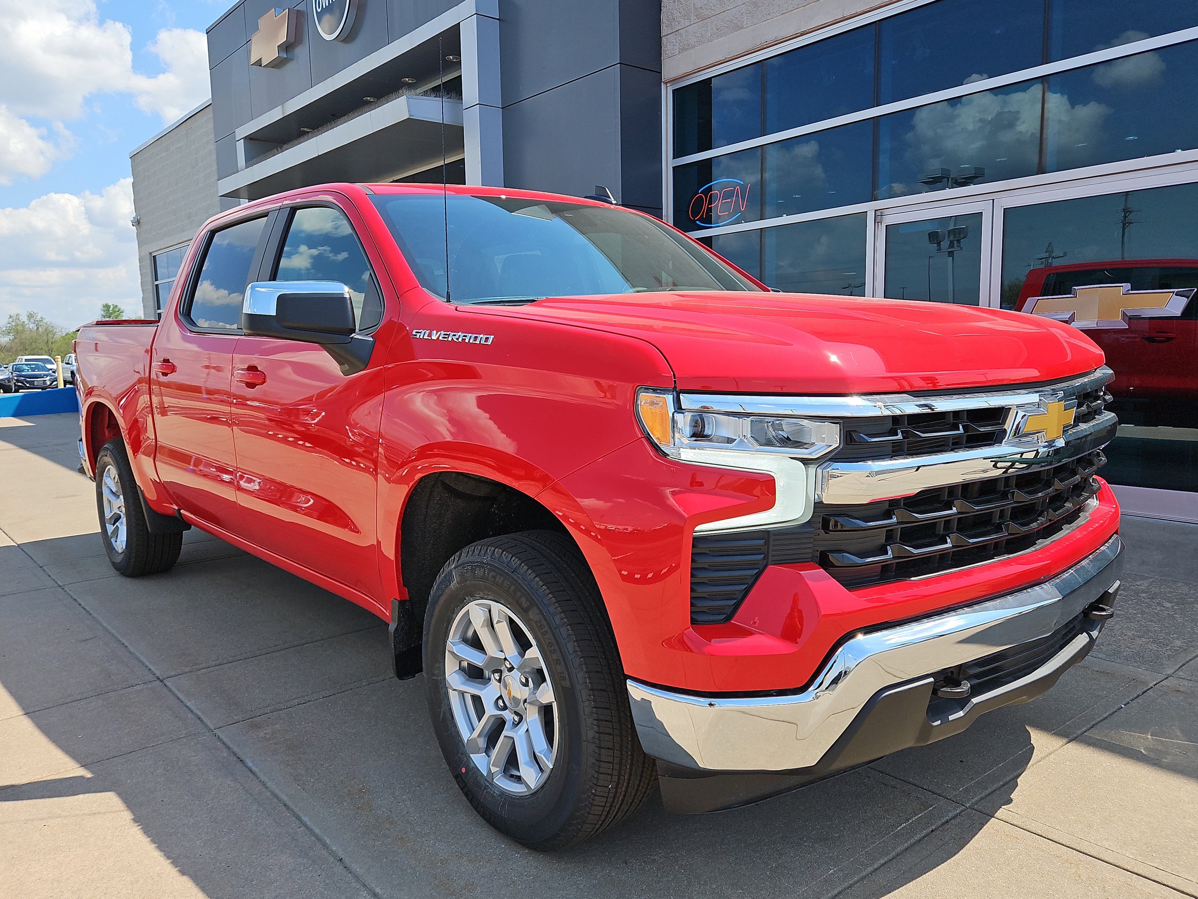 2026 Chevrolet Silverado 1500 LT in Red Hot — front three-quarter view