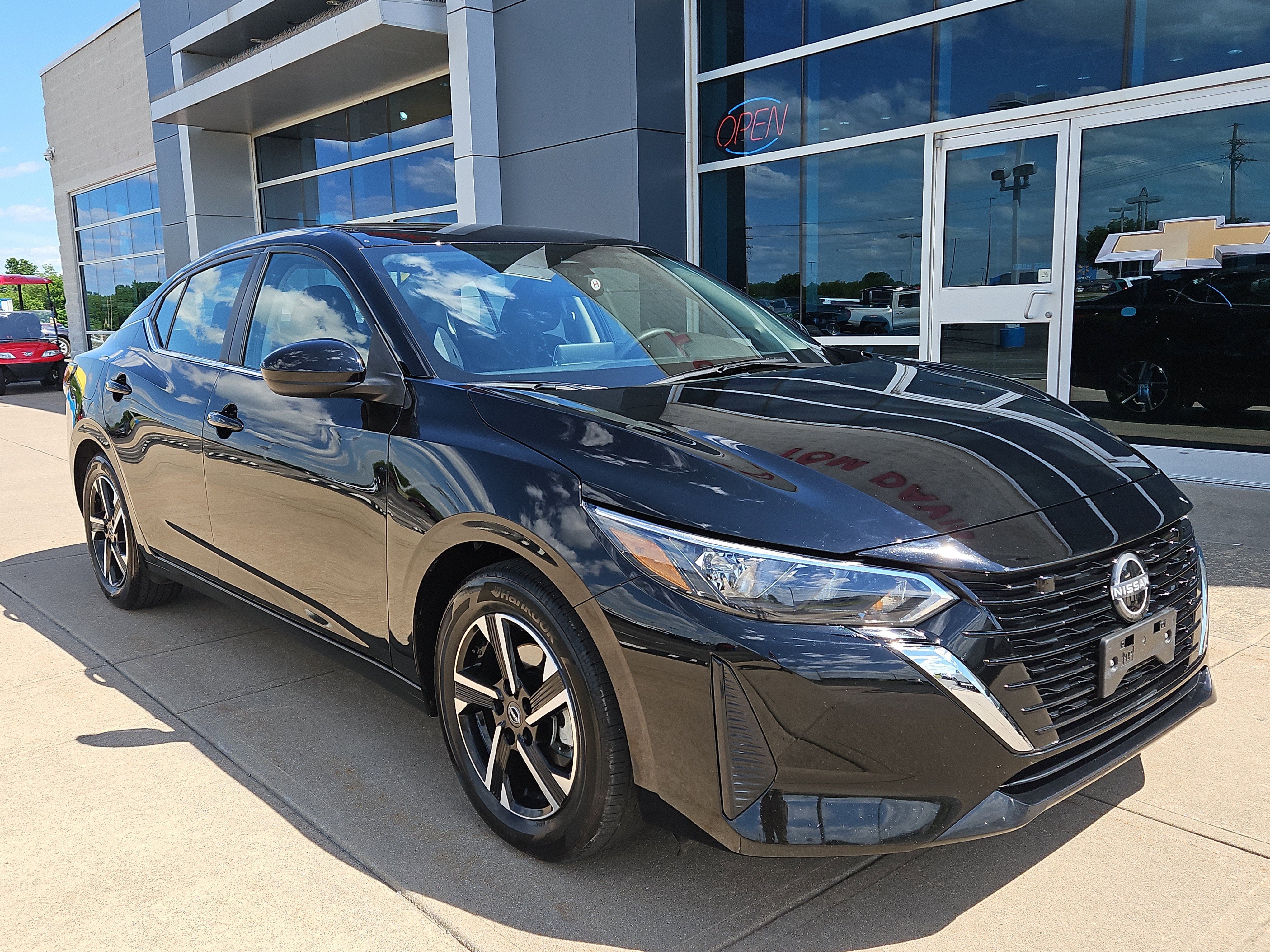 2025 Nissan Sentra SV in Black — front three-quarter view